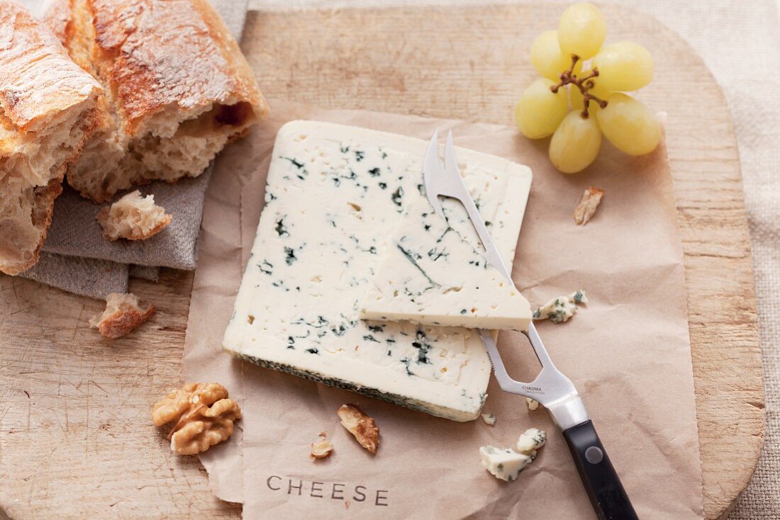 Blue cheese, bread, nuts and grapes