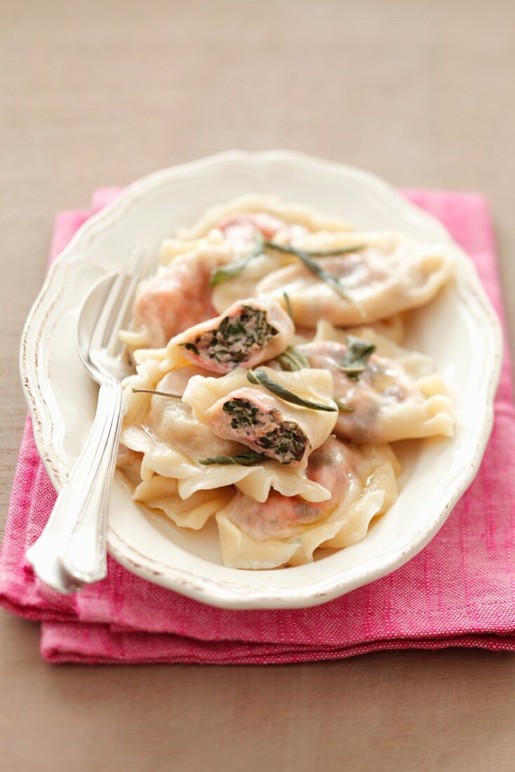 Pierogi (steamed dough parcels) filled with cream cheese and beetroot leaves