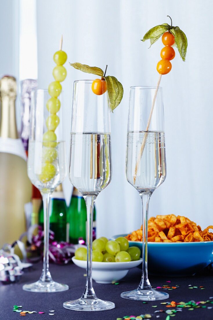 Fruit kebabs in champagne glasses