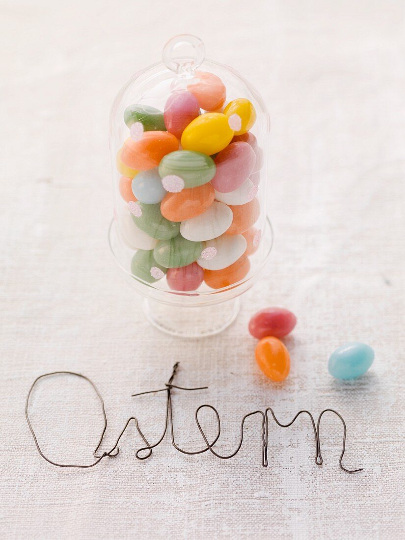 Sugar eggs in a glass with a domed top, for Easter