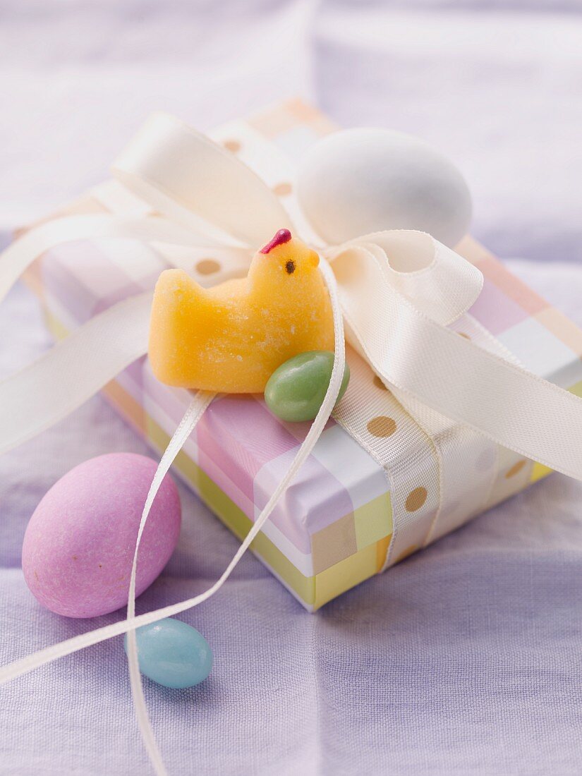 An Easter parcel with a fondant chick and Easter eggs