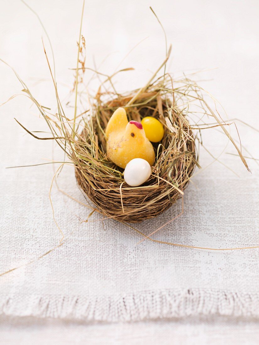 An Easter nest with a fondant chick and sugar eggs