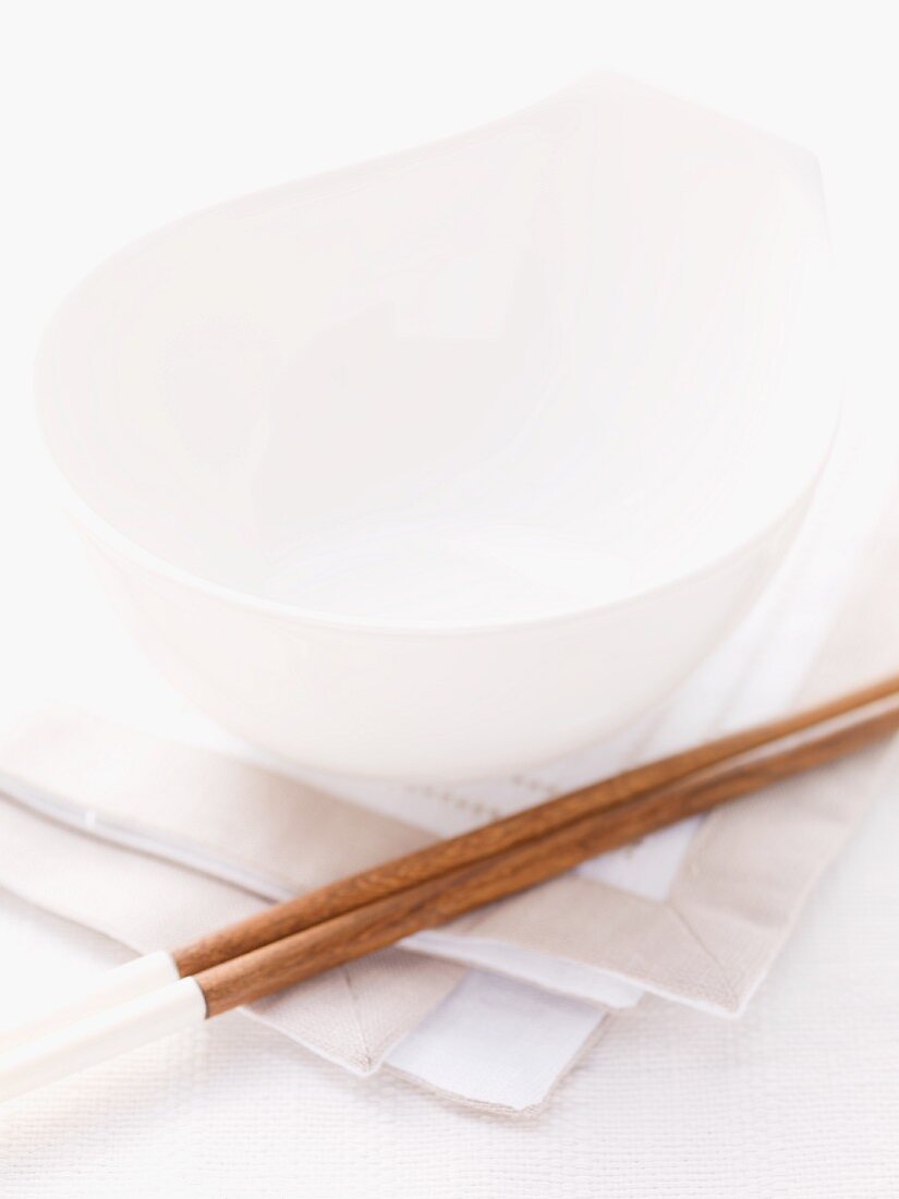 Table setting with bowl and chopsticks on a napkin (Asia)