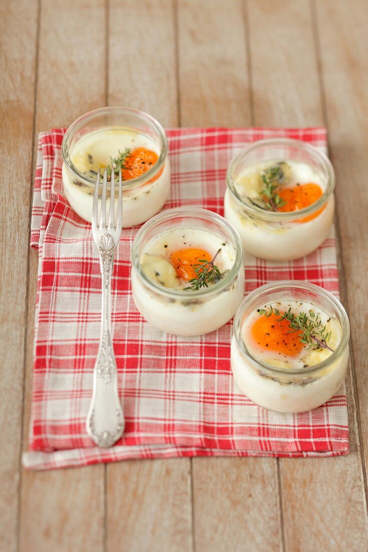 Eggs in glasses with thyme