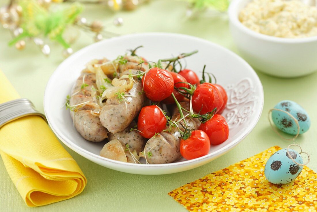 Bratwurst sausages with cherry tomatoes and onions for Easter