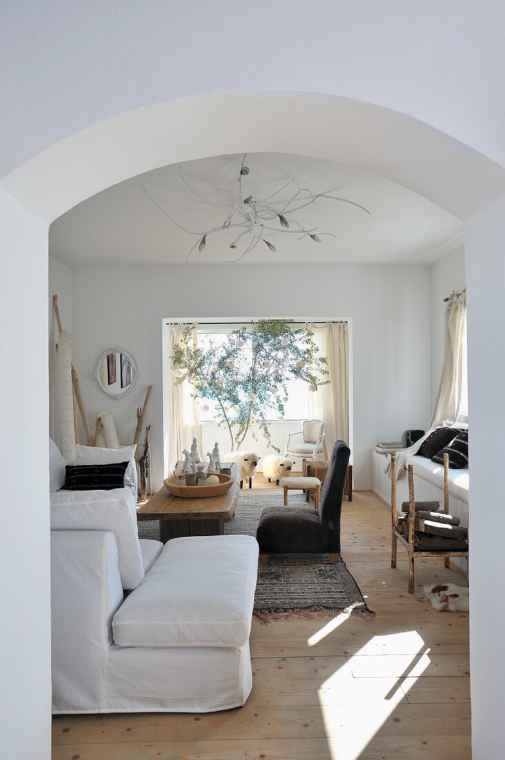 Cozy living room in earth tones with assorted seating options, decorated in North African style