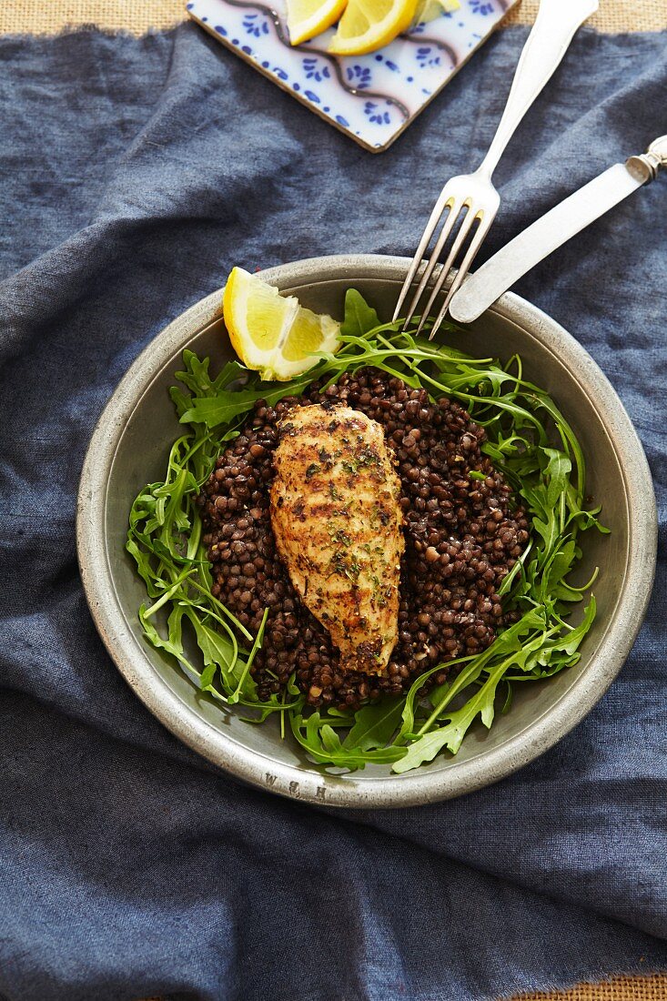Chicken breast on lentils with rocket