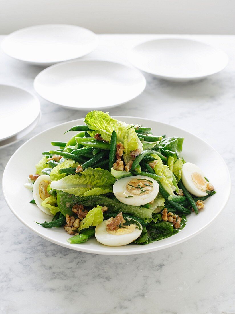 Green bean salad with hard-boiled eggs and walnuts