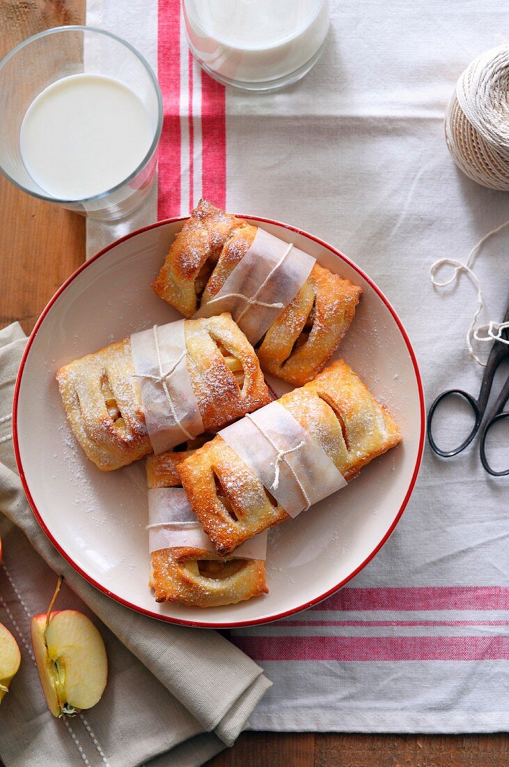 Apple turnovers wrapped in paper