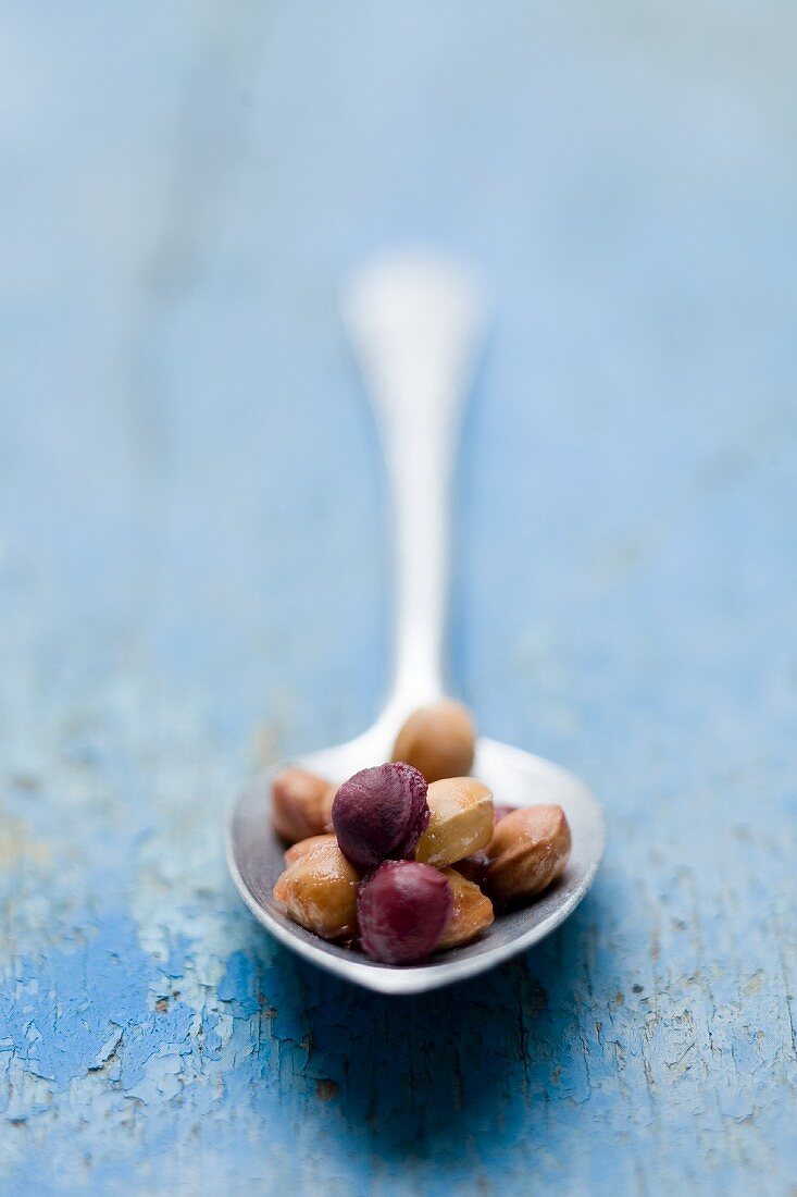 Several cherry stones on a spoon