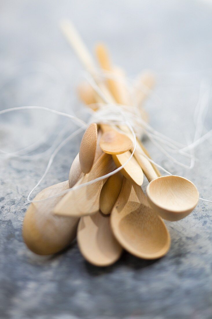 Several wooden spoons, tied in a bundle