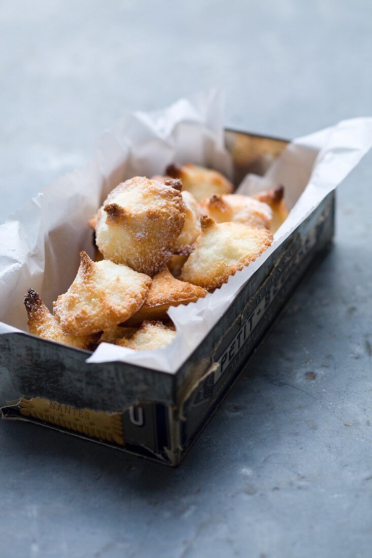 Coconut macaroons in a biscuit tin