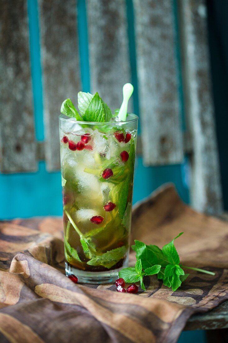Ginger beer cocktail with mint and pomegranate
