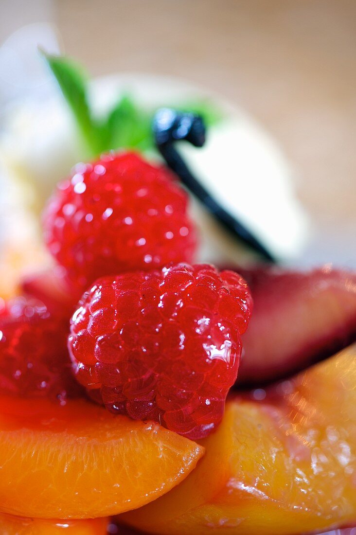 Pancakes with peaches, raspberry and lemongrass (close-up)