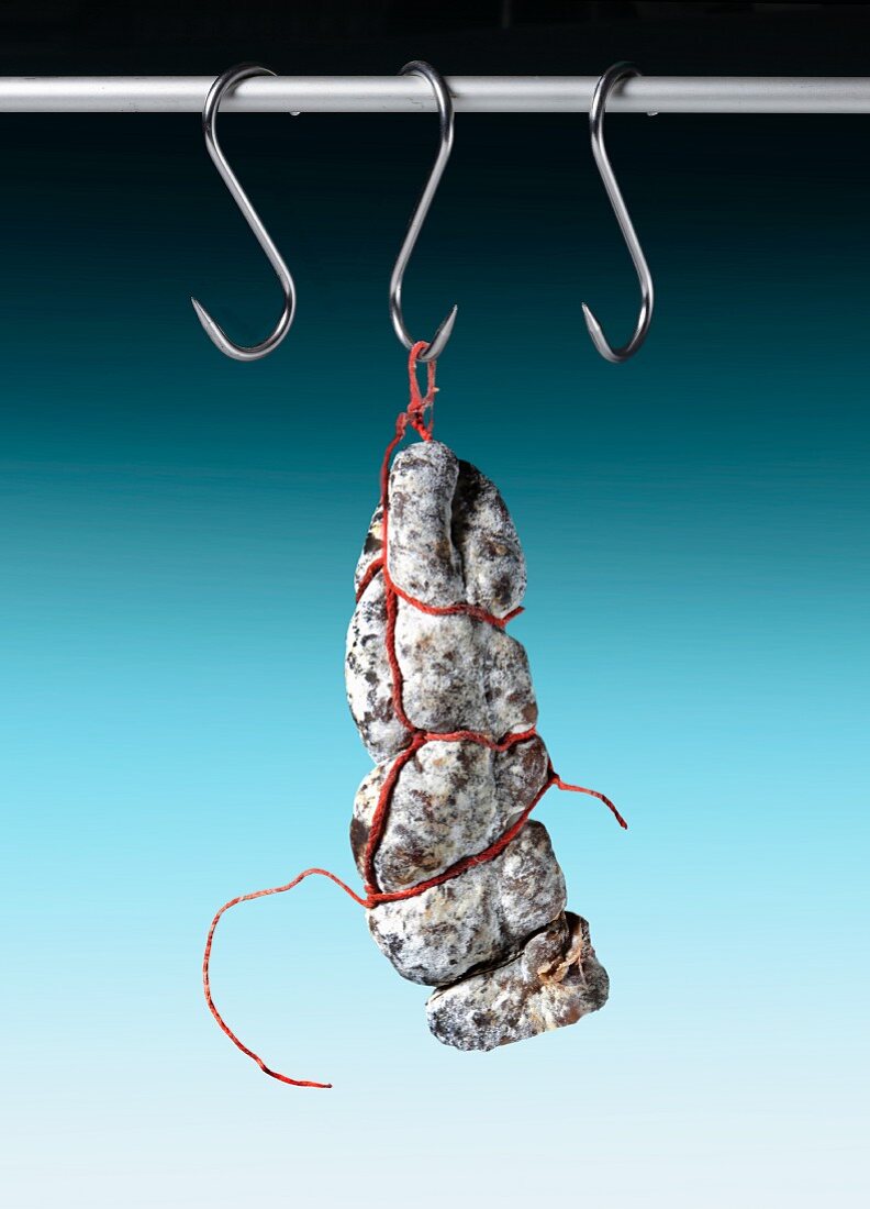 Salami hanging from a hook