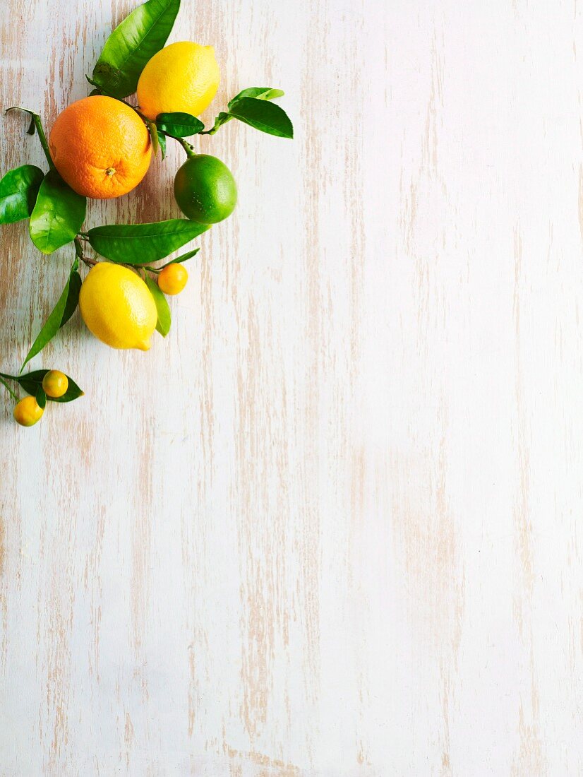 Citrus fruits on a white wooden surface