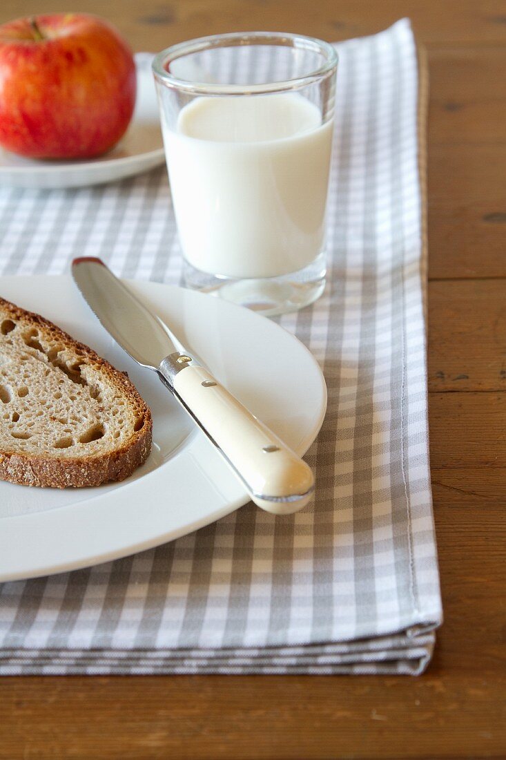 Milk, bread and an apple, for breakfast
