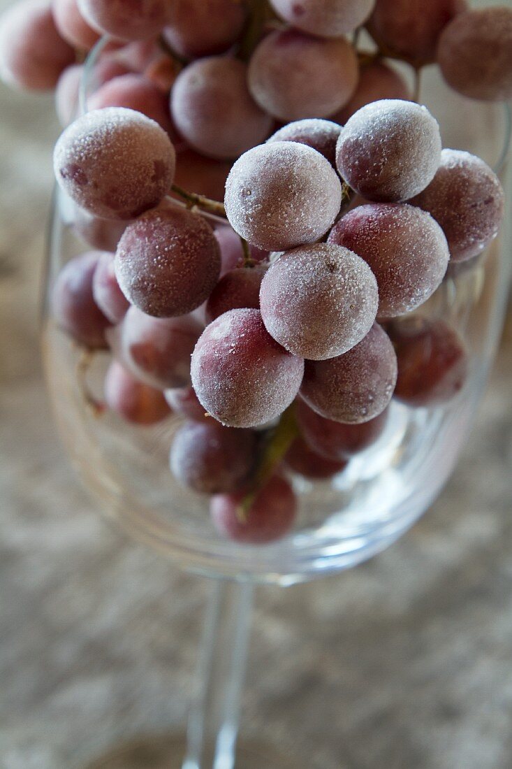 Frozen grapes in a wine glass