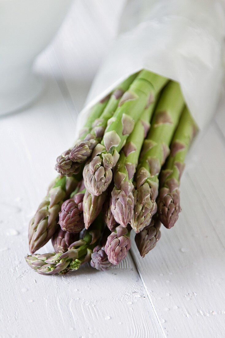 Green asparagus wrapped in paper