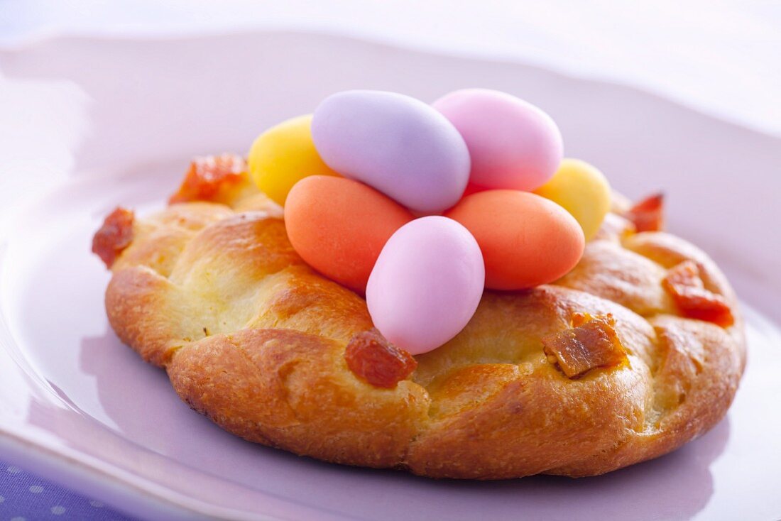 Yeast doughnut with marzipan eggs (close-up)