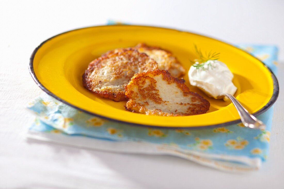 Potato fritters with a dollop of sour cream and dill