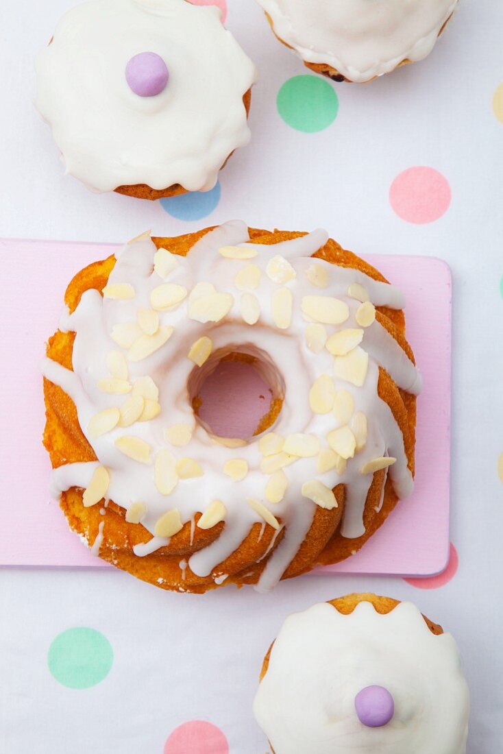 Babka (Easter cake, Poland) with white icing and sliced almonds