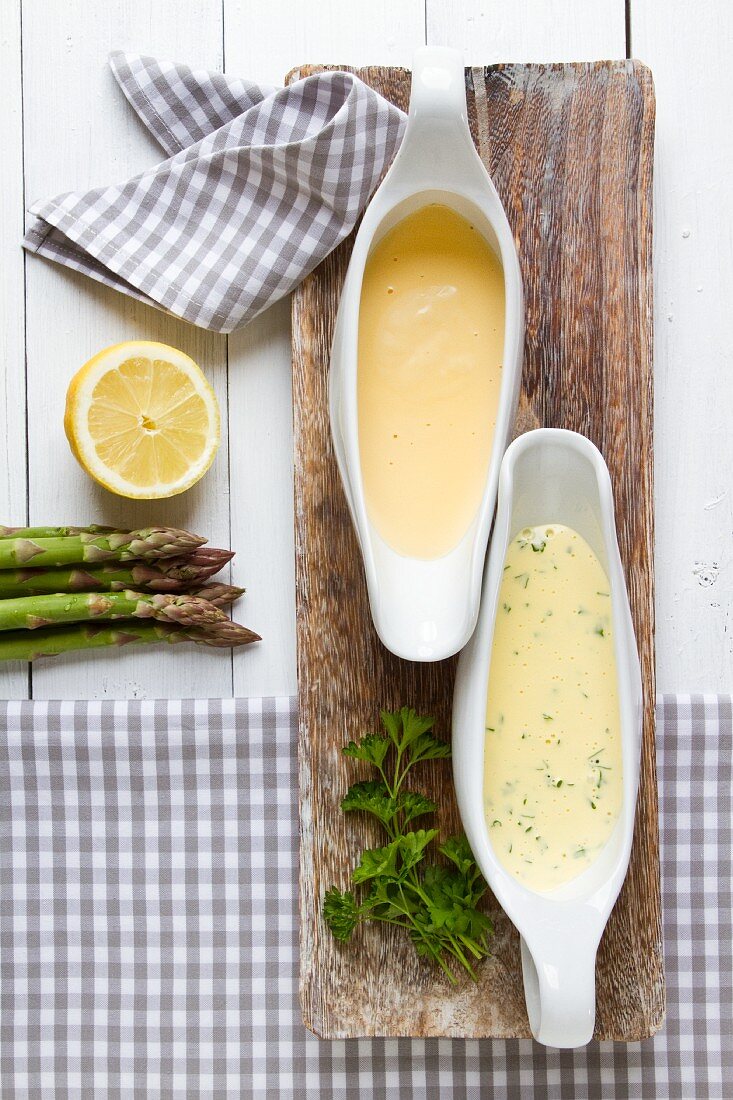 Two sauces served with asparagus