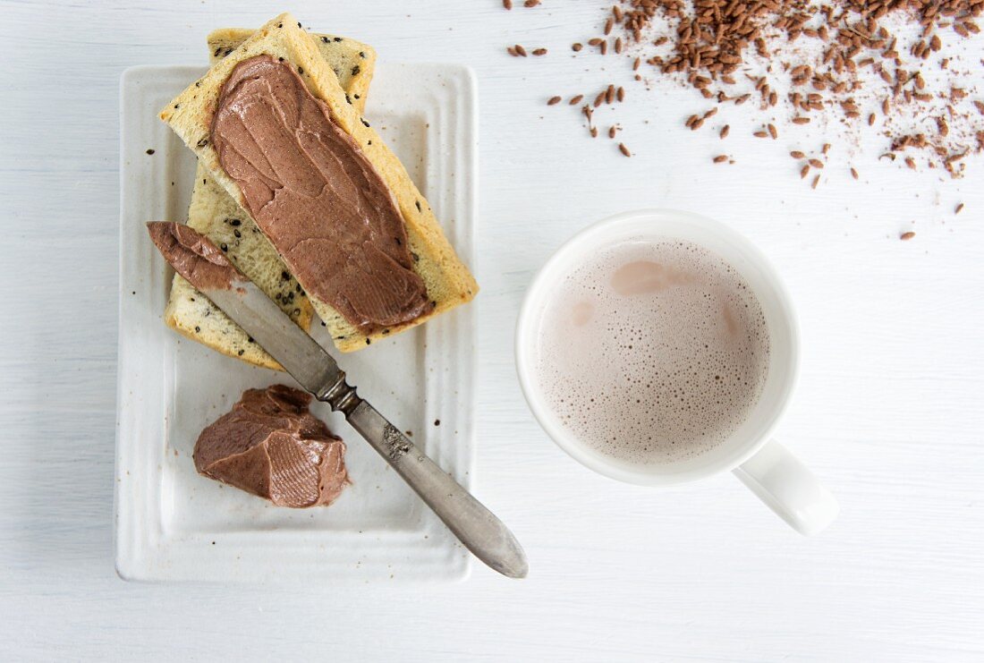 Sesame-seed toast spread with lavender chocolate, and a mug of cocoa