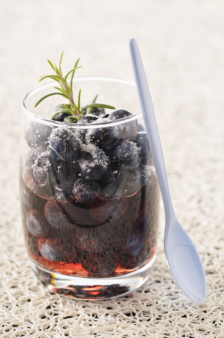 Blueberries in red wine with rosemary