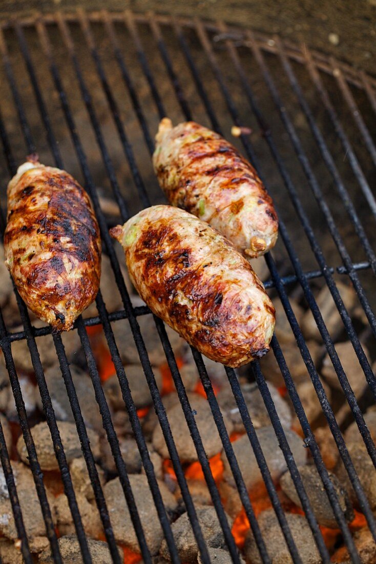 Minced meat sausages on the barbecue