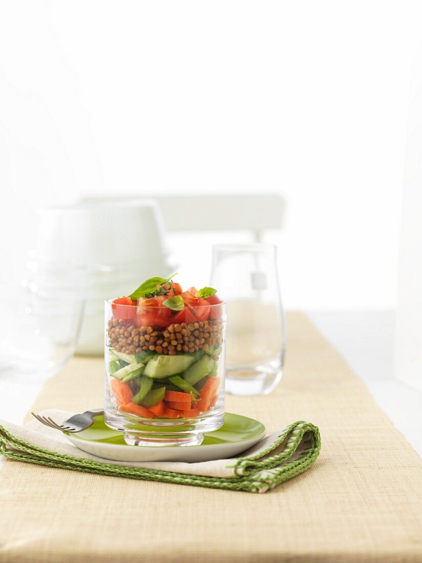 A starter of carrots, celery, cucumber, lentils and tomatoes