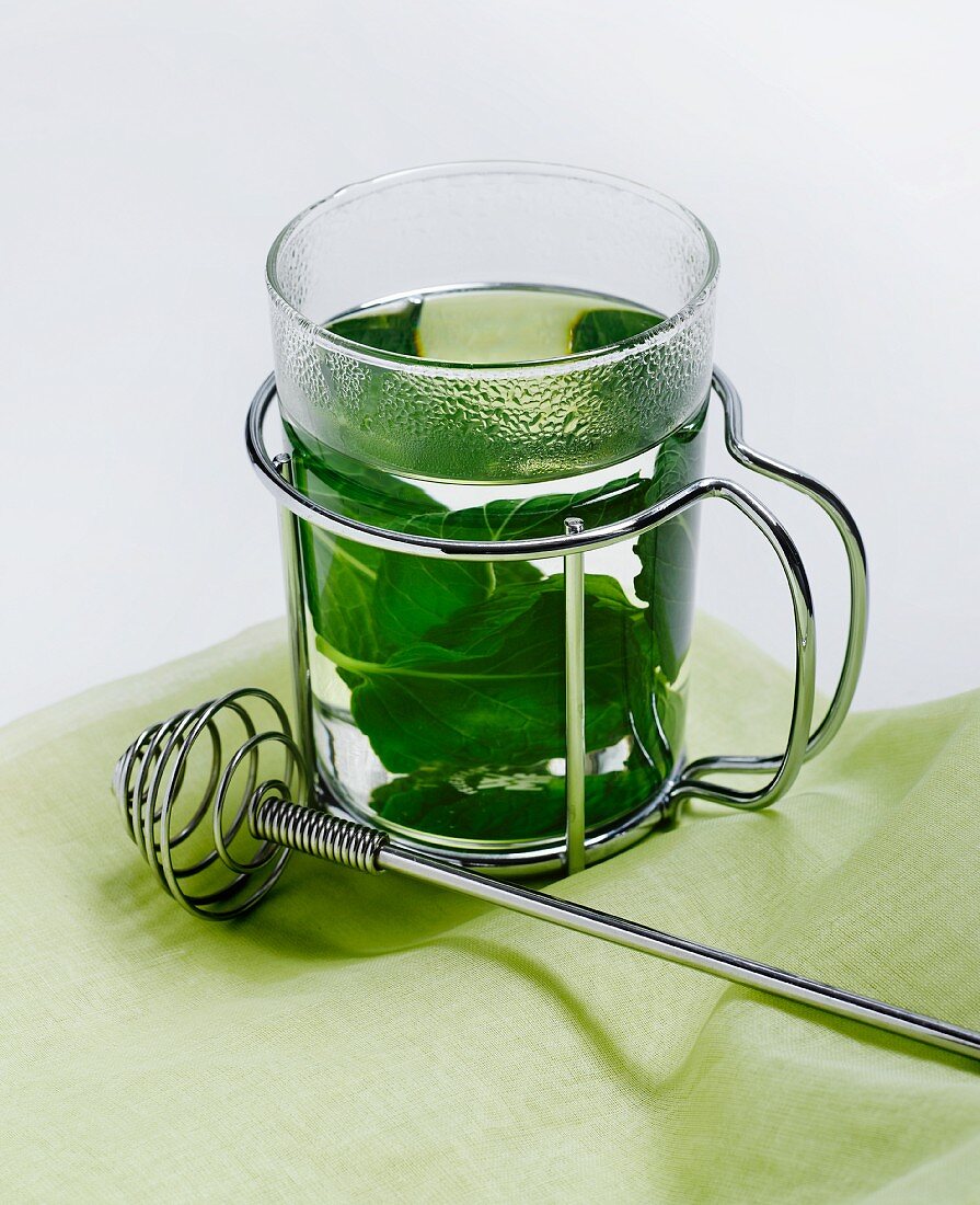A Glass of Mint Tea with Fresh Mint Leaves