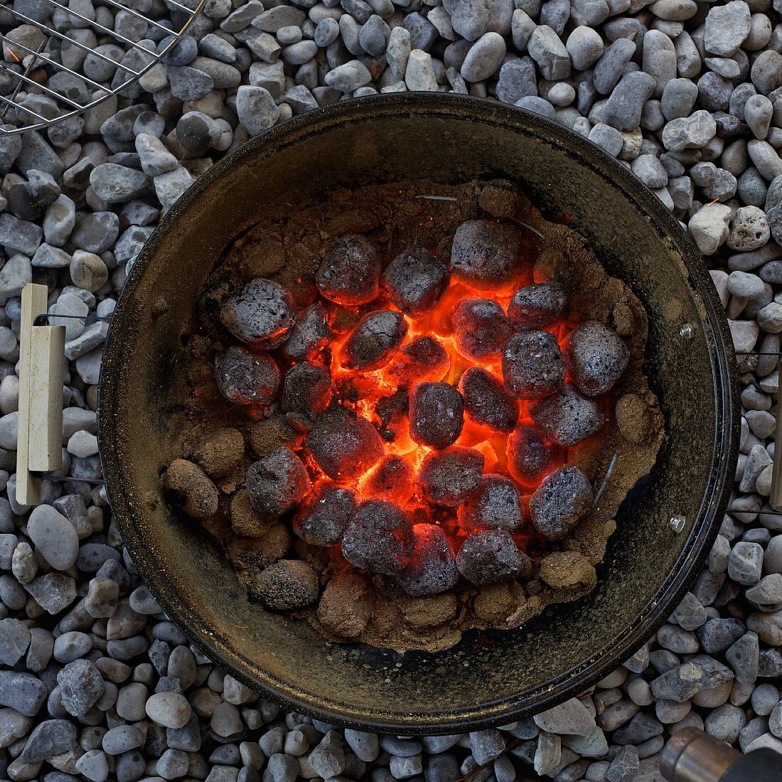 A barbeque with glowing coals