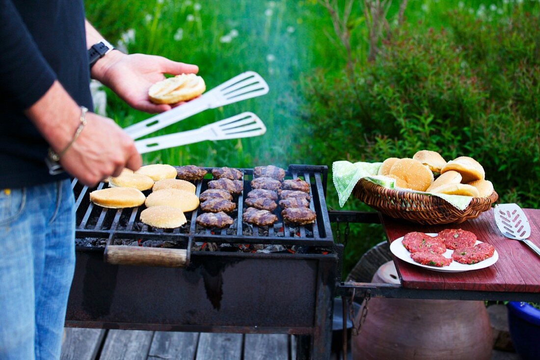 Burgers and rolls on the barbecue