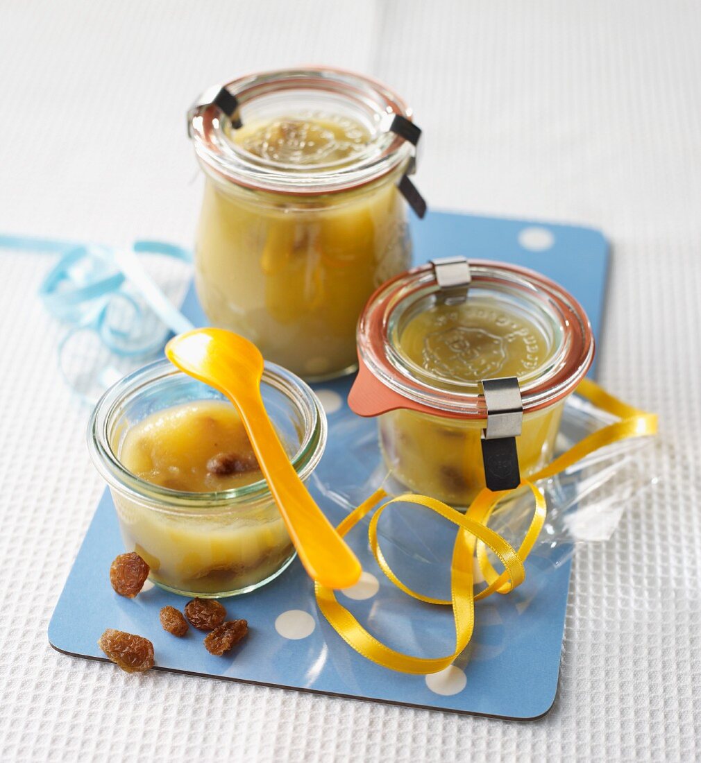 Apple sauce with raisins in preserving jars