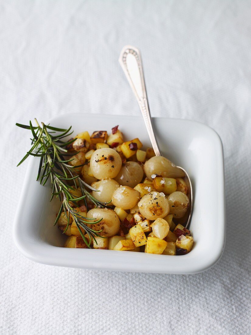 Fried potatoes with pearl onions and rosemary