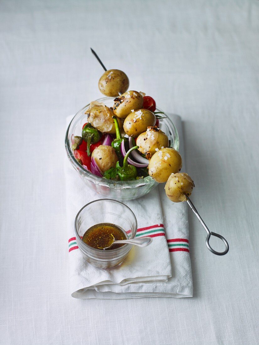 Potato salad with a skewer of potatoes