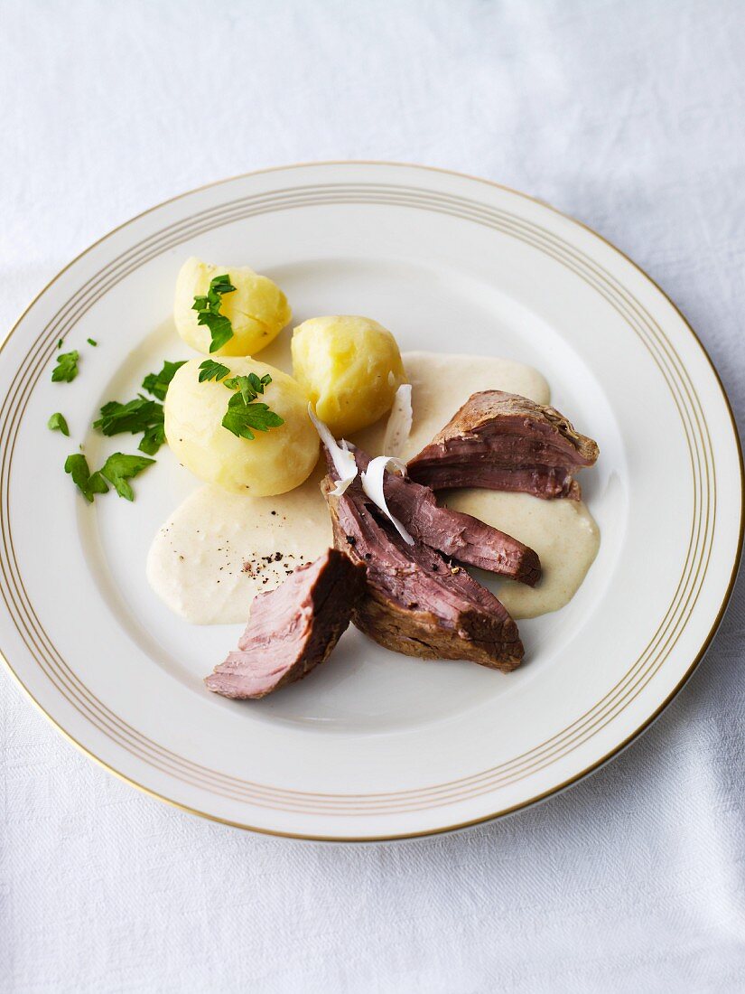 Beef brisket with horseradish sauce and boiled potatoes
