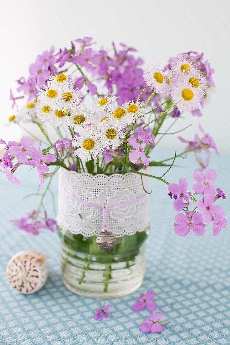 White and Purple Wild Flowers in a Vase with Ribbon