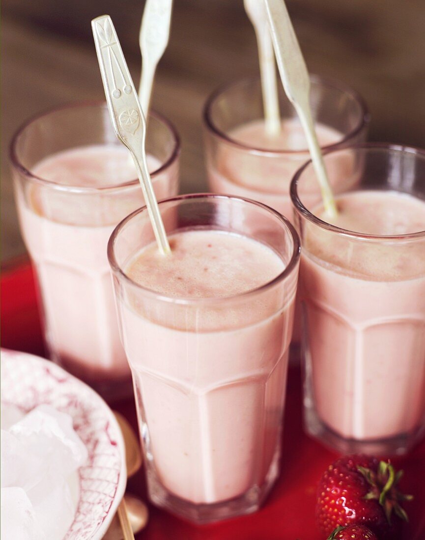 Four strawberry smoothies
