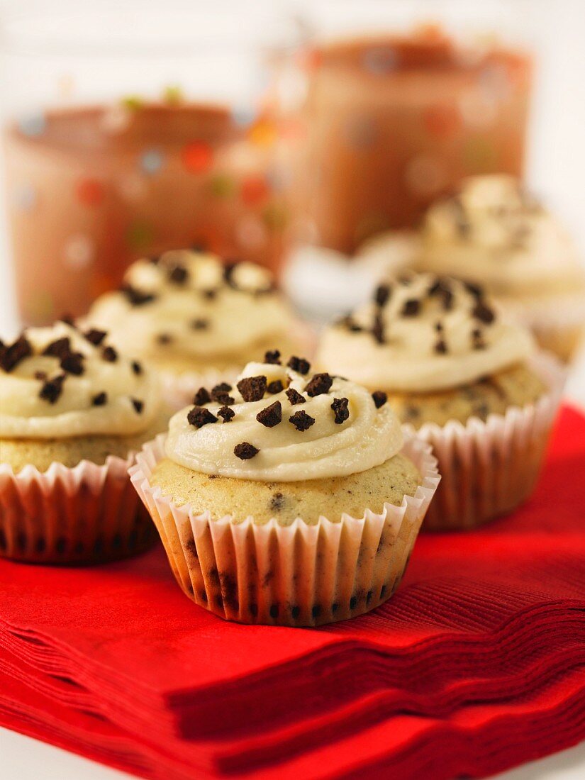 Cupcakes with nut icing on a red paper napkin