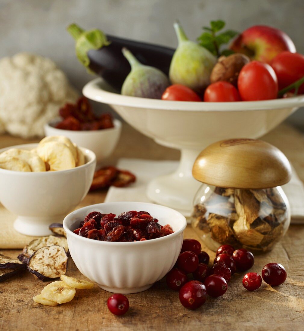 A still life featuring dried fruits and vegetables