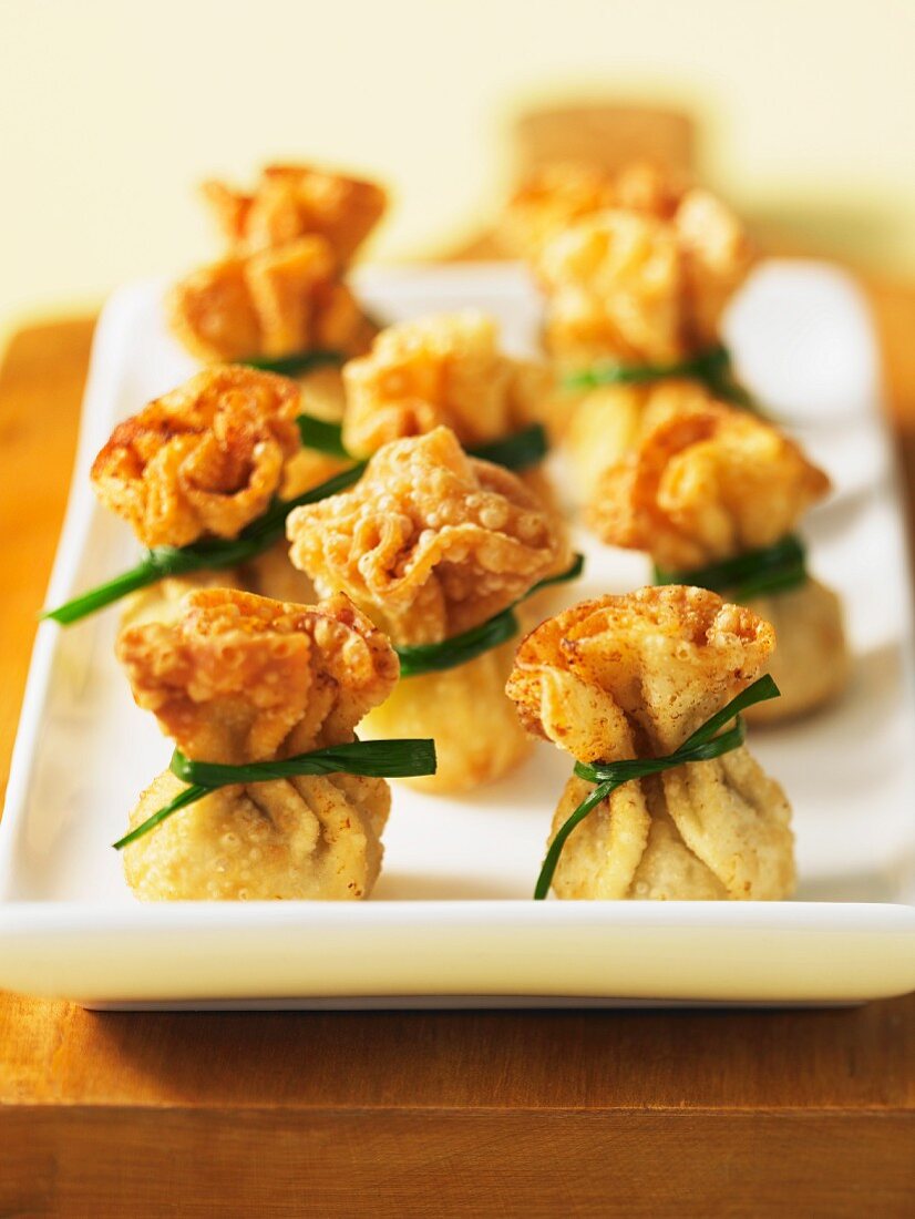 Wontons tied with chives