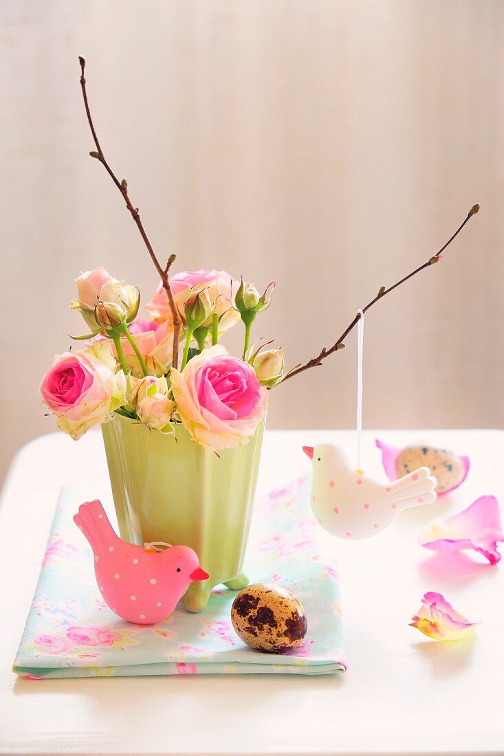 Vase of roses with Easter decorations