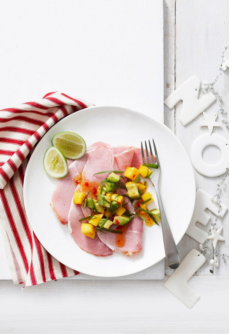 Ham with mango salsa and lime