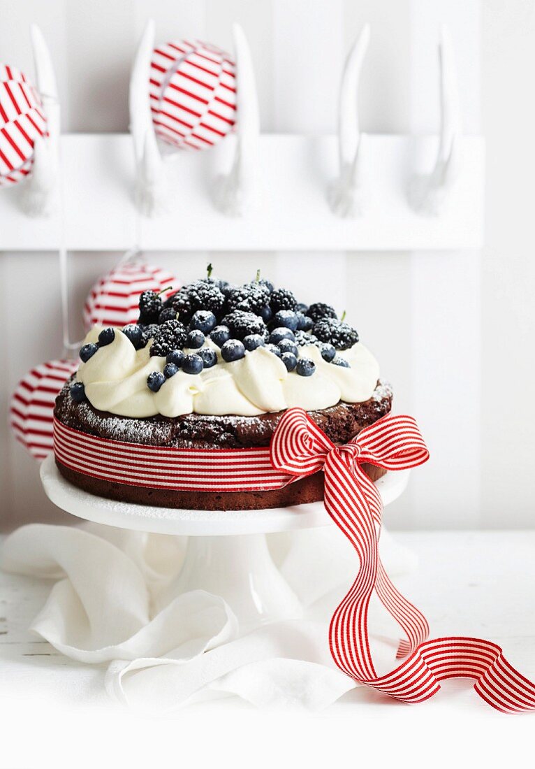 Flourless chocolate cake with cream and berries