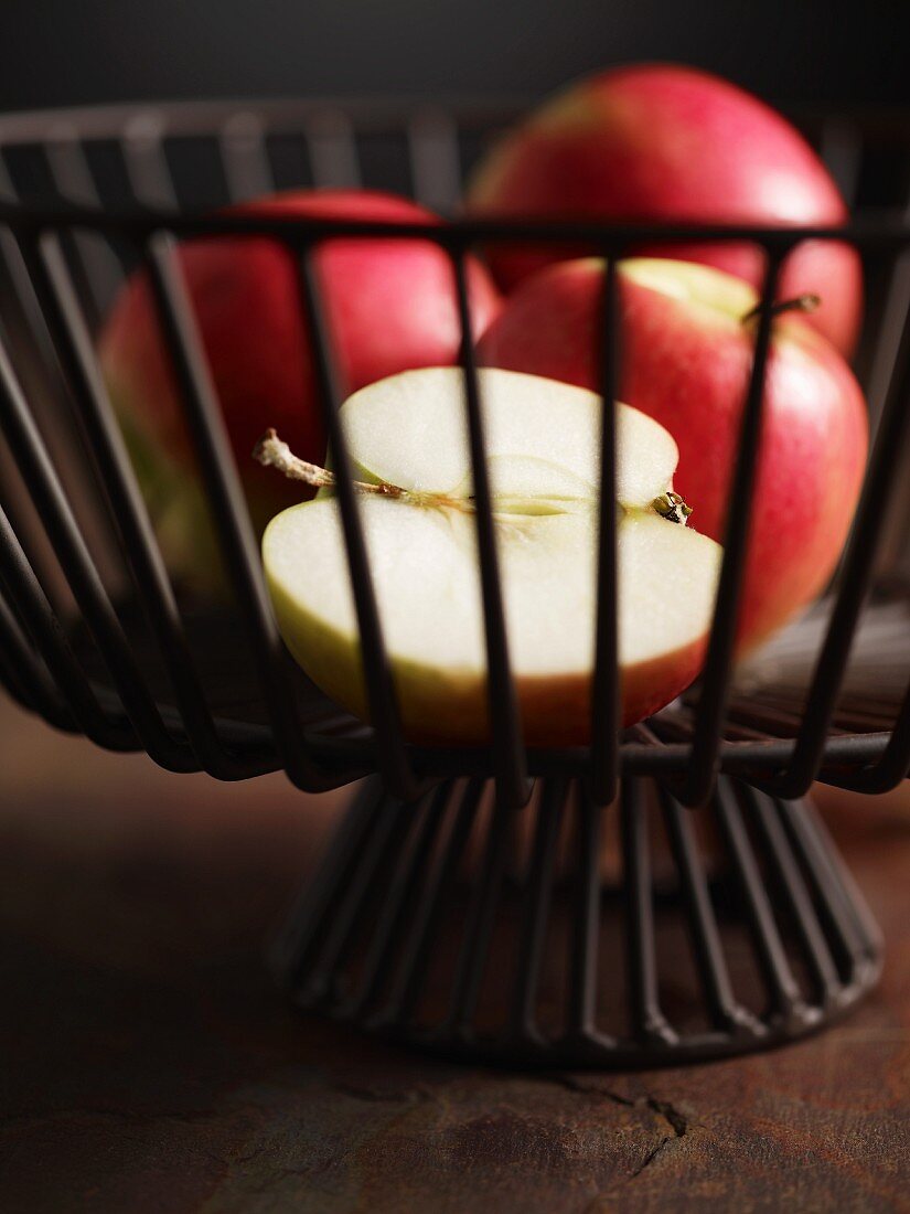 Pink Lady apples in a wire basket
