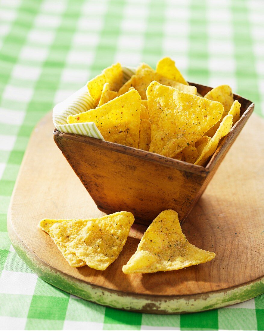 Dill flavour tortilla chips in a wooden bowl