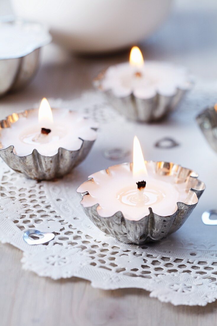 Small cake moulds filled with wax and used as tealights