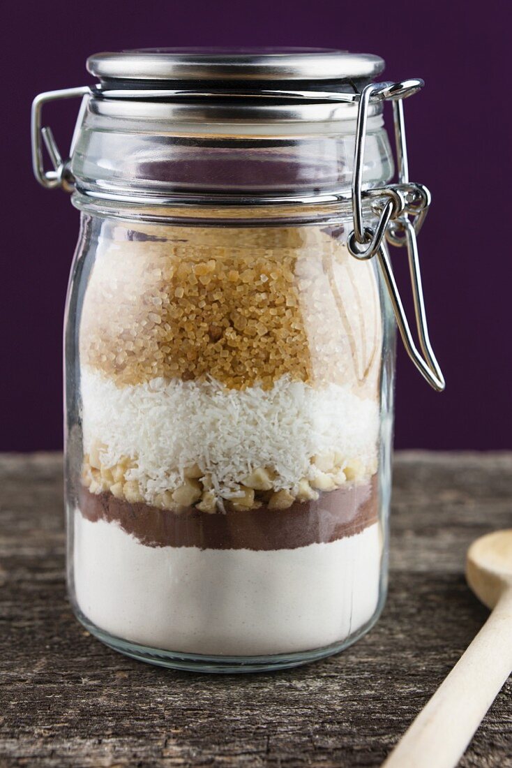 A preserving jar containing the dry ingredients for making coconut and nut biscuits